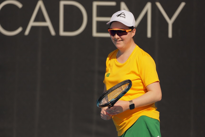 Breanna Tunny holds a tennis racquet.