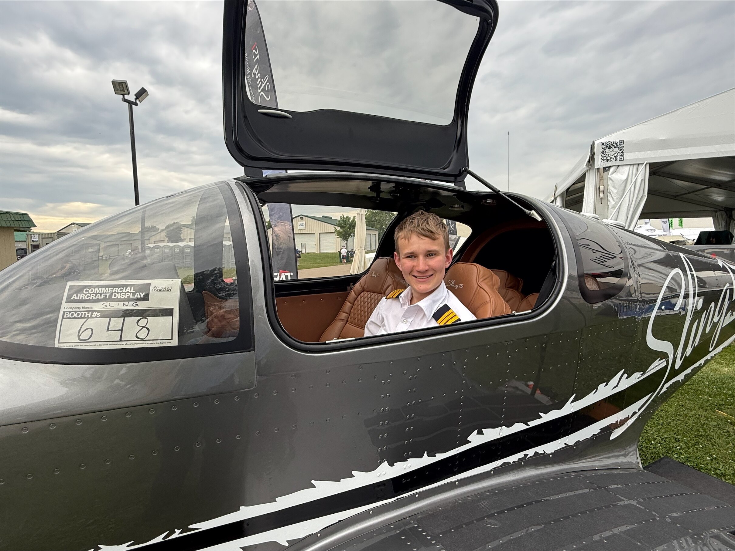 Young boy sitting in plane