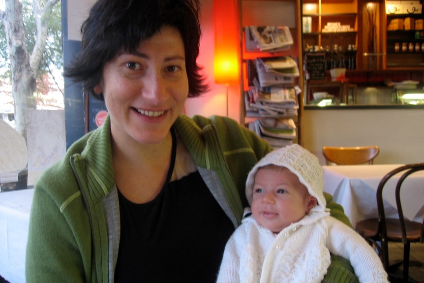 Vickie Veitch with baby daughter Ebony in a cafe.
