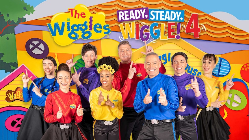 All eight Wiggles holding up their Wiggly fingers