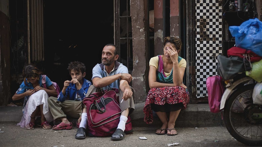 Colour photo of Haita 'Cedra' Izam, Zain Al Rafeea, Fadi Kamel Youssef and Kawthar Al Haddad Bankole in 2018 film Capharnaüm.