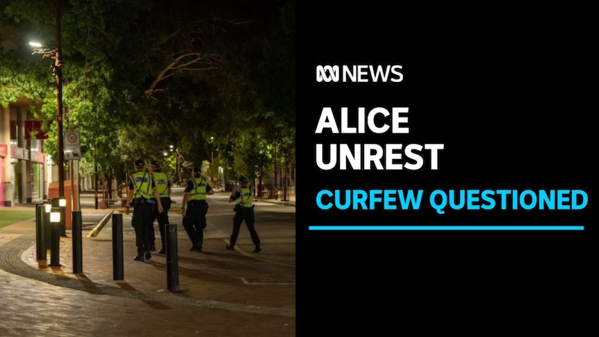 Alice Unrest, Curfew Questioned: Police wearing yellow high visibility vests walk through concourse at night.