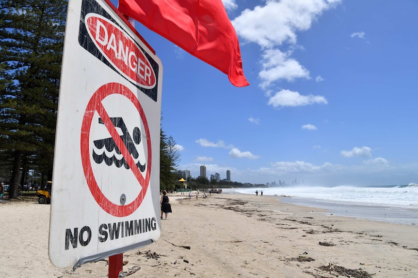 A no swimming sign at Burleigh Heads beach