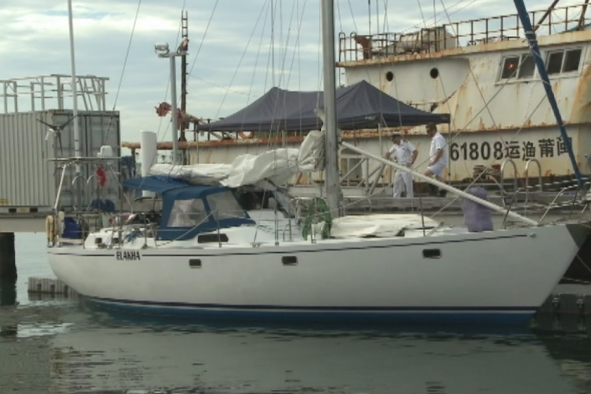 A yacht tied up at a marina.