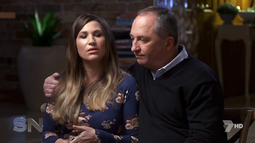 A screenshot from a television interview shows Barnaby Joyce with his arm around Vikki Campion