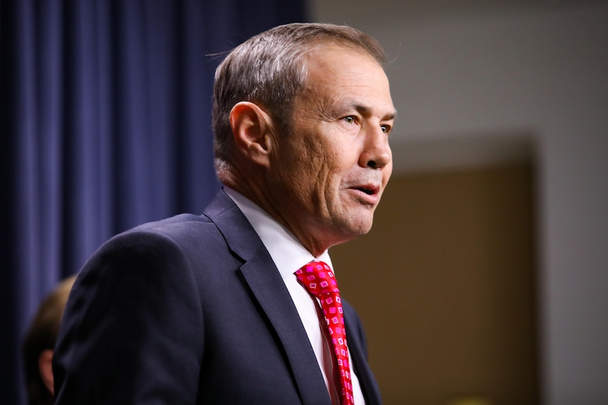 Health Minister Roger Cook at the border announcement