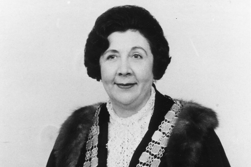 A black and white photo of Nell E Robinson