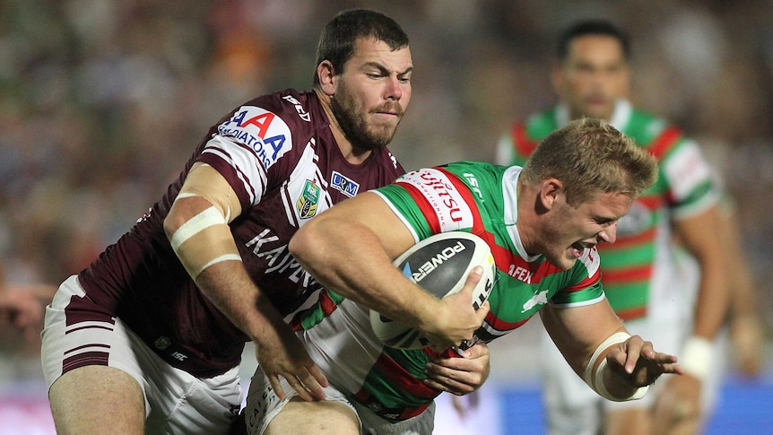 Bruising encounter ... George Burgess makes a hit-up for the Rabbitohs