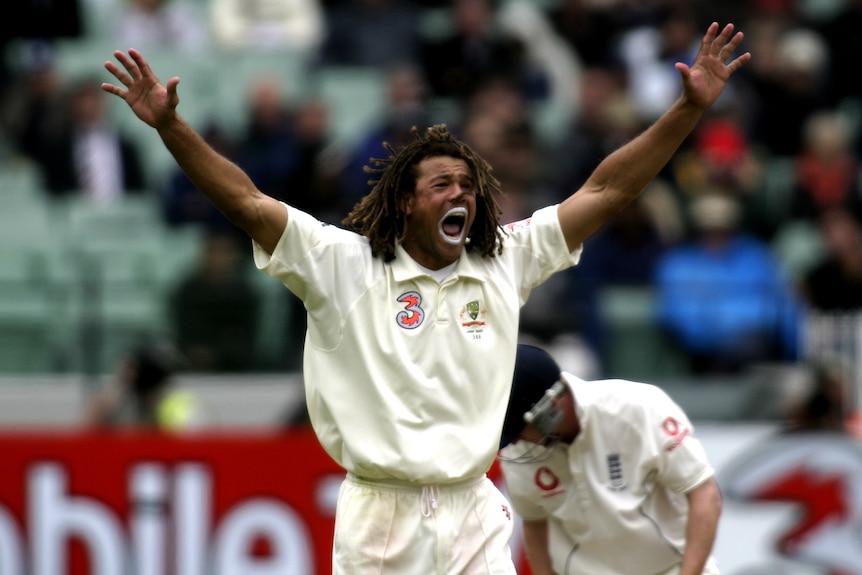 Andrew Symonds keeps his arms in the air, asking for a wicket