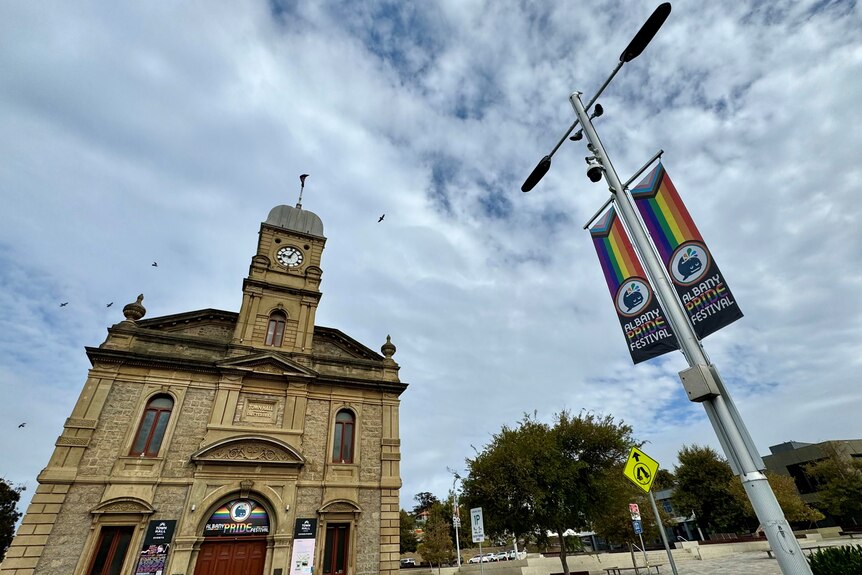 Pride banners erected along a street in a country town.