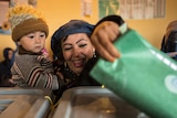 Afghan woman casts ballot