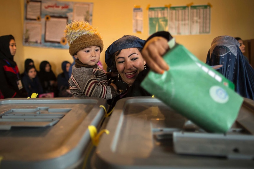 Afghan woman casts ballot