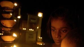Vigil: Sri Lankans light lamps to commemorate the 35,000 people who died.