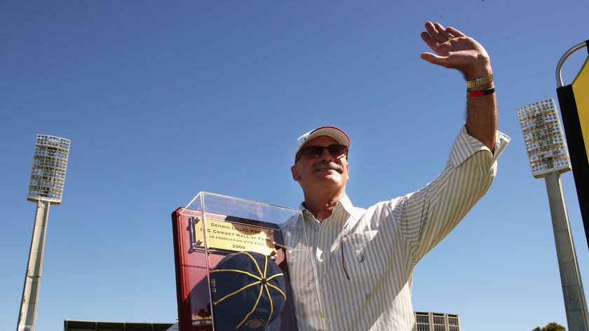 Dennis Lillee shows his ICC Hall of Fame cap to the crowd during a Test at the WACA in 2009.
