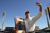 Dennis Lillee shows his ICC Hall of Fame cap to the crowd during day two of the third Test.