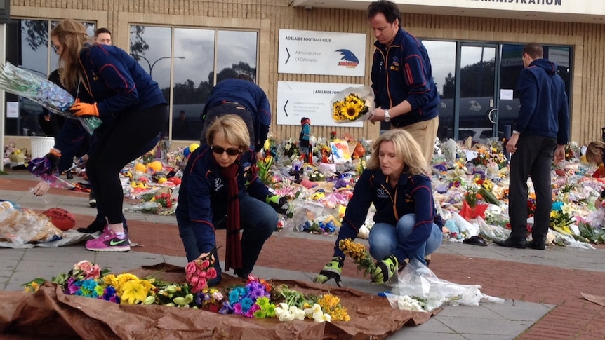 Walsh flower clean up at Football Park