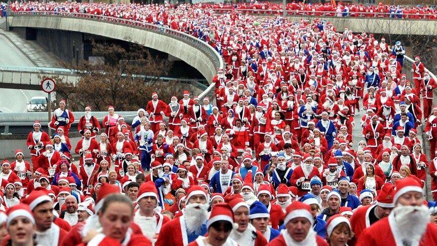 Santas run in the Santa Dash in Liverpool, north-west England.