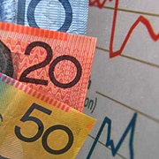 Australian currency is seen next to a wages graph