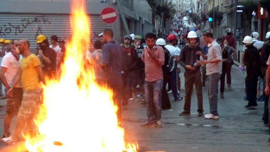 A fire burns during anti-government protests.