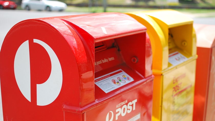 Australia Post mail boxes stand by the side of the road