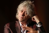 Bob Geldof called the lack of effort shown by wealthy nations to stop HIV a 'scandal'.