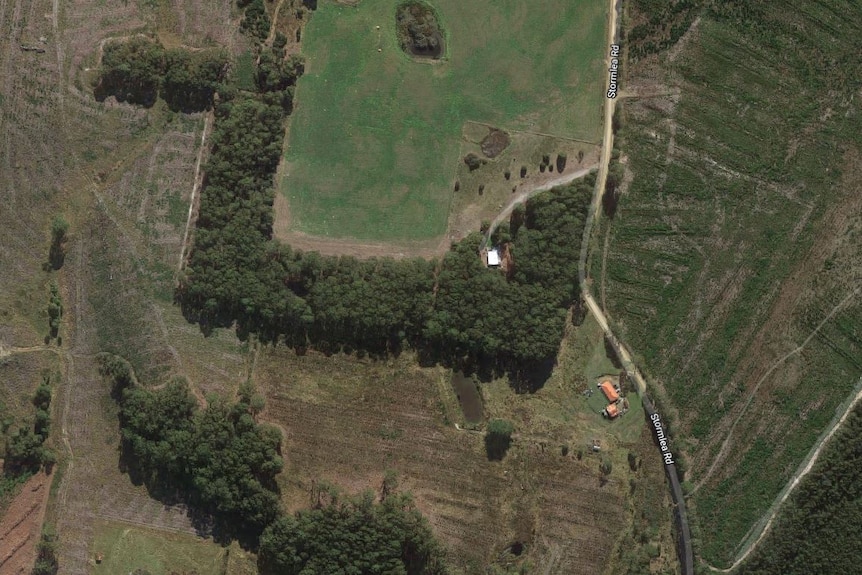 A satellite map view of a road and rural properties.