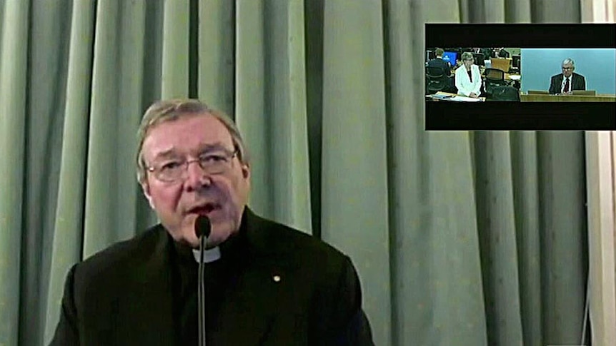 Cardinal George Pell sits in front of a green curtain giving video evidence to the royal commission, inset top right.