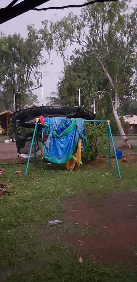 Lawn furniture strewn around by a storm in katherine.