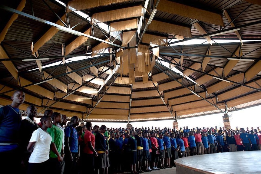 School children standing in a hall in Uganda.