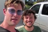 Actor Chris Hemsworth and musician Scott Hildebrand standing together.