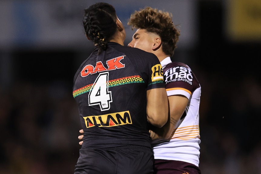 Taylan May collides with Reece Walsh during a 2024 NRL match.