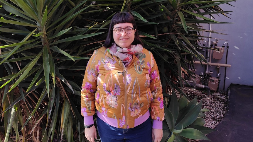 Carla Donnelly stands in front of plants for a story about salary sacrificing into super.