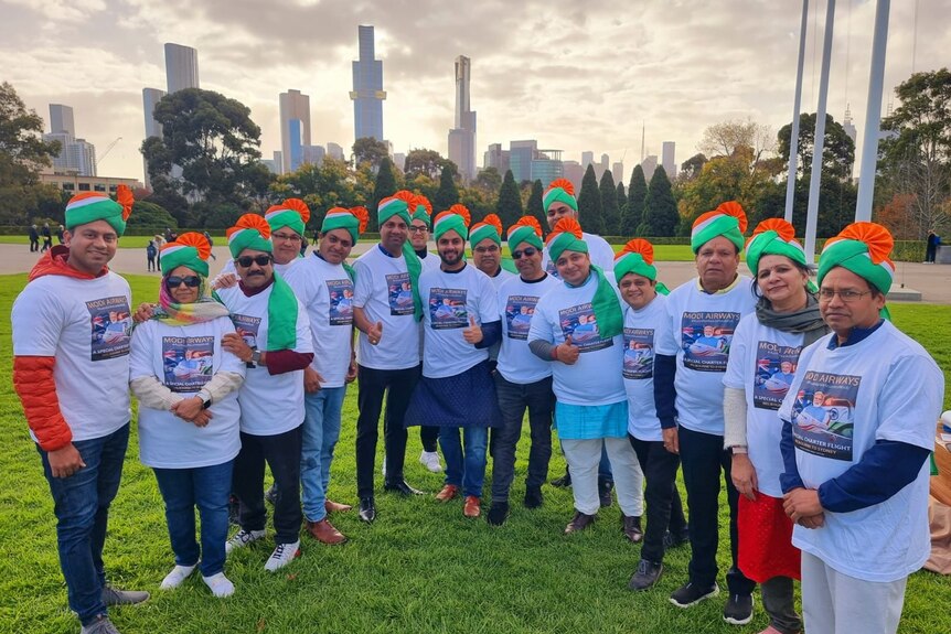 A group of people wearing Modi Airways t-shirts