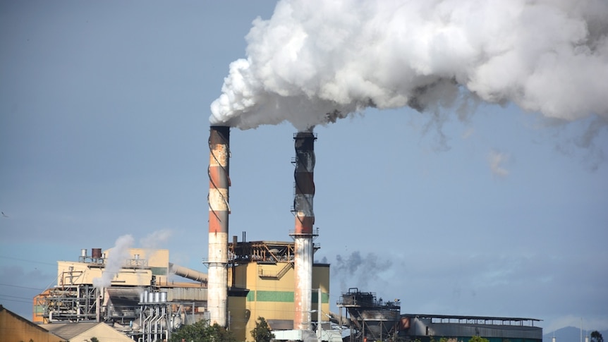 Steam coming from stacks at a sugar mill at Mackay