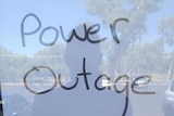 A sign saying closure due to power outage