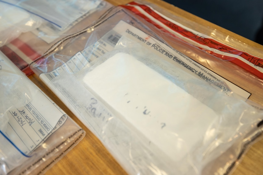 A bag of white powder on a table.