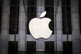 An Apple logo hangs above the entrance to the Apple store in Manhattan, New York City
