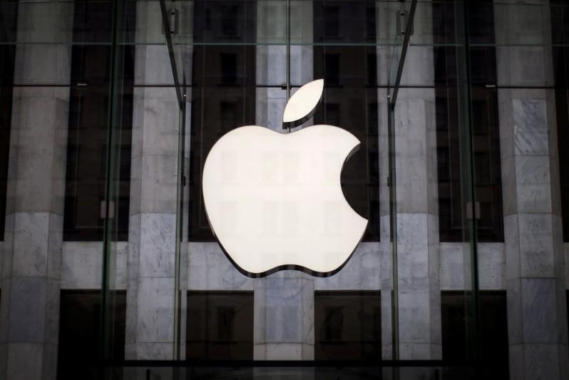 An Apple logo hangs above the entrance to the Apple store in Manhattan, New York City