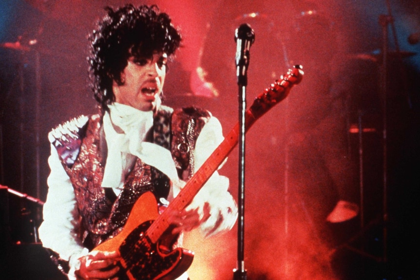 Prince performs on stage in 1985.