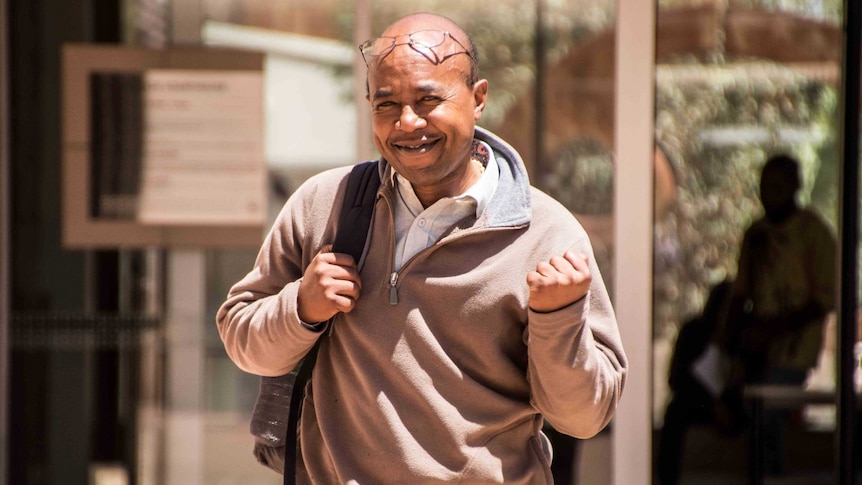 A man walks free from a court house