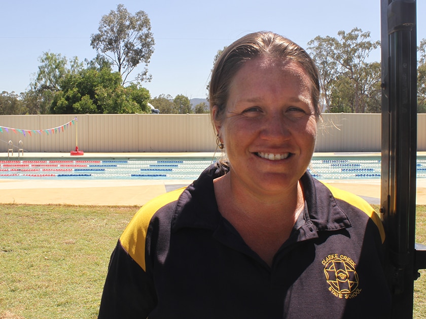 Clarke Creek State School's Kelly Soutter stands by the pool gate.