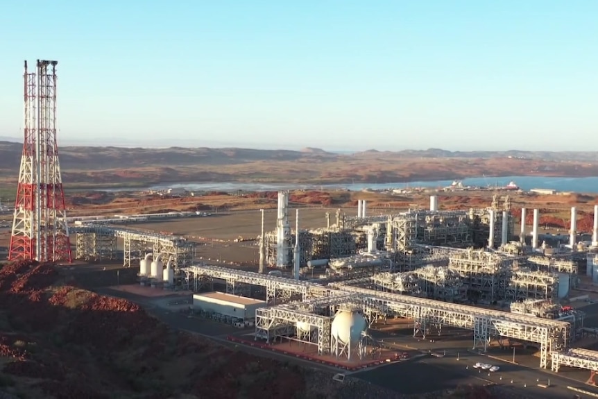 An aerial view of a gas plant on the coast