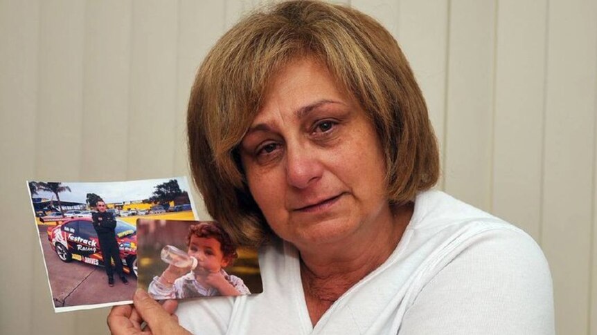 Adriana Buccianti holds photos of her son, Daniel, who died in 2012 of a drug overdose.