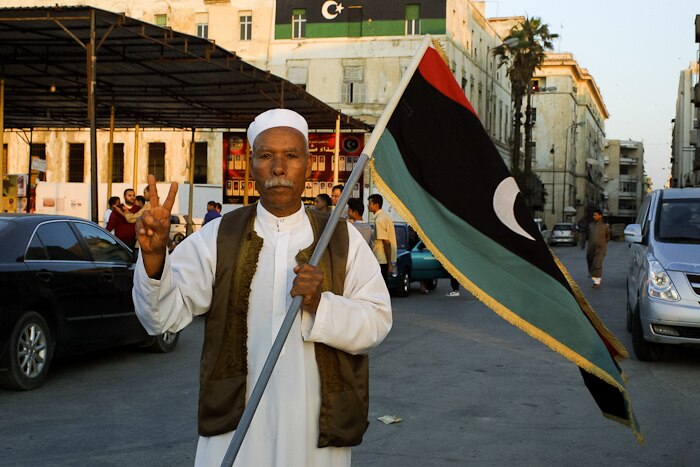 Benghazi demonstrator with Libyan flag