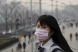 Young woman wears mask in Beijing