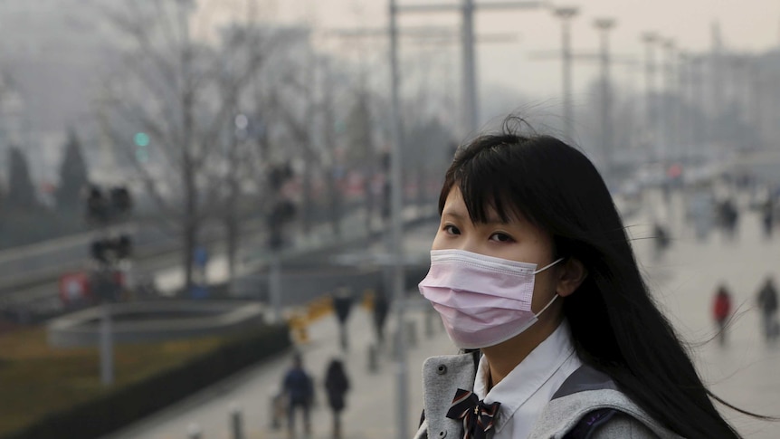 Young woman wears mask in Beijing