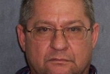 A police mugshot of alleged drug dearler Robert Gee — a middle-aged man wearing glasses.