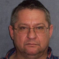 A police mugshot of alleged drug dearler Robert Gee — a middle-aged man wearing glasses.