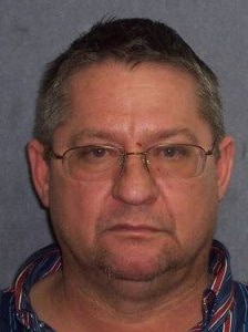 A police mugshot of alleged drug dearler Robert Gee — a middle-aged man wearing glasses.