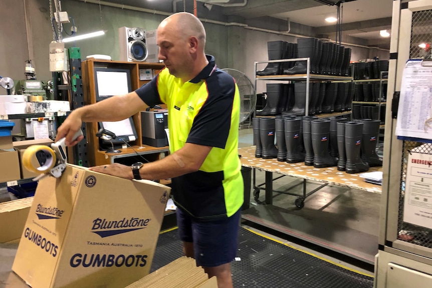 Craig Burr at work at the Blundstone Hobart-based gumboot factory.